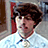 A pixelated image shows a person with brown hair and light skin wearing a white shirt, next to blue text on an orange background reading "vote for Pedro".