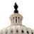 Pixelated image of a domed building with a dark spire atop, featuring vertical windows and segmented architectural details on the dome's surface.