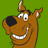 Pixelated cartoon dog head with brown fur, black nose, white teeth, and green background.