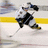 Pixelated static image of a hockey player in mid-action on an ice rink, holding a stick with yellow and gray background elements.