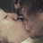 Pixelated image of two people kissing on left, green background with pink text reading 'true love really does exist.'