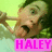 Pixelated image of a character with green hair holding a glass, set against a light background with pink text reading HALEY.