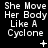 White pixelated text on black background reads "She Move Her Body Like A Cyclone" with small white symbols below each instance.