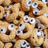 Pixelated image of repeated cereal pieces with teal text reading 'cheerios' on the right side.