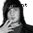 Pixelated grayscale image of a person with long dark hair, hand near face, and partial text 'ent' visible above the head.