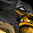 Pixelated static image of a yellow and black creature with glowing eyes against dark background.