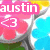 A pixelated image of pink flowers with yellow and blue accents, featuring the name 'austin' in different colored text boxes and a heart symbol.