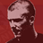 Pixelated static image of a person's head and shoulders against a solid red background, with visible dithering and low-resolution rendering artifacts.