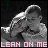 A black-and-white animated sequence shows a person holding another in an embrace, with pink text and symbols changing below.