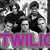 Black-and-white pixelated image of two figures in dynamic poses with a purple text overlay reading 'TWILIG' on a gray background.