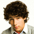 Pixelated close-up of a person with dark curly hair, light skin, and a beard wearing a gray jacket over a red shirt against white background.