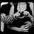 Black-and-white pixelated image of two figures embracing, with blue text reading 'emo', 'love', and 'forever' on a black background.