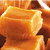 A pixelated orange-brown object with rounded edges and a hollow center, appearing in multiple repeated instances across the frame.