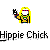 Pixelated character with long yellow hair, white face, red-blue headband, and colorful outfit holding a black object against gray background.