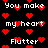 Pixelated text and red heart symbols on a black background, with repeated phrases 'you make my heart flutter' in white block letters.