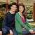 Two people sit on a bench in an outdoor setting with greenery and wooden railings; text overlays appear sequentially.
