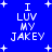 Blue background with white pixelated text reading "I LUV MY JAKEY" and small plus signs scattered across the image.