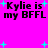Bright pink background with black text reading "Kylie is my BFFL" repeated four times, surrounded by cyan plus signs and small cyan dots.