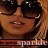 A pixelated close-up of a person with light brown hair wearing dark sunglasses, showing two slightly different mouth positions.