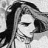 Black-and-white pixelated image of a person with long dark hair, closed eyes, and visible facial features including nose and mouth.