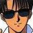 Pixelated close-up of a person with dark hair and dark sunglasses, wearing a light-colored shirt with a dark collar, against a bright background.