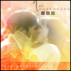 Two figures in close embrace with blurred facial features, set against a warm-toned background of orange and yellow hues.