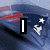 A static image with a blue and red striped background featuring white stars, displaying the text "I Still Love Tom Brady." in bold black-outlined letters.