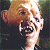 A 50x50 pixel animated contact sheet showing two frames of a character from The Goonies with green text reading "Original Icons .com" on the right side.