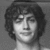 Black-and-white pixelated image of a person with curly hair, showing subtle facial expression changes across three views.