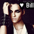 Pixelated image of a person with dark hair wearing a white tank top and dark vest, hand raised near head, with 'Bill' text and heart symbol in top-right corner.