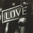 A pixelated grayscale icon shows a signpost with the word LOVE in block letters, set against a dark background.
