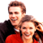 Static 48x48 pixel icon showing two smiling people in close proximity with brown hair and red clothing, rendered in low-resolution pixel art style against a white background.