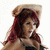 A woman with long red hair wears a beige cowboy hat, black crop top, and dark pants in two poses against white background.