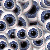 A static image with a background of clustered eyes and text reading "The Pool of eyes" and "You are always staring waiting to drown" in white on red.