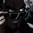 Pixelated 48x48 animated buddy icon featuring a character in dark clothing with light hair and text elements on black background.