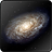 A pixelated spiral galaxy with a bright central core and diffuse arms extending outward against a dark background.