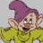 A pixelated cartoon character with purple hat and yellow shirt next to black text reading "This is Dopey. He don't talk none" on a white background.