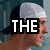 A four- shows a person in profile wearing a white headband and dark cap, with text overlays changing