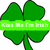 Green four-leaf clover with a green banner reading 'Kiss Me I'm Irish' across the top leaf.