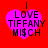 Four identical pink heart-shaped icons with black text "I LOVE TIFFANY M1$CH" on a red background, arranged in a