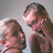 Two people in a close-up pose on the left, with pink and gray background containing pixelated text