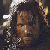 A pixelated image of a person with long hair and armor, accompanied by text fragments on white background.