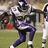 Pixelated football player in purple and white uniform holding a ball, with pink text 'Roo' and 'Football' on black background.
