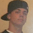 A person wearing a dark cap and dark shirt with white trim appears in four , with the rightmost empty