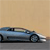 Pixelated side view of a light blue convertible car on a gray road against a beige sky background.