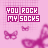 Pink background with repeated text "YOU ROCK MY SOCKS" and blurred pink butterfly/glasses shapes