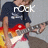 A person in a dark blue shirt plays an electric guitar with red and yellow gradient body, white pickguard, and silver hardware against gray background.