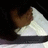 Pixelated image of a brown animal head resting on a white triangular shape against dark background.