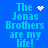 Blue background with cyan text "The Jonas Brothers are my life!" and four distinct white pixel animations: heart, starburst, dots, and sparkles.
