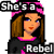 Pixelated cartoon woman with brown hair and pink headband in two animated frames showing slight facial expression change, wearing black top with pink collar and text "Rebel" on chest.